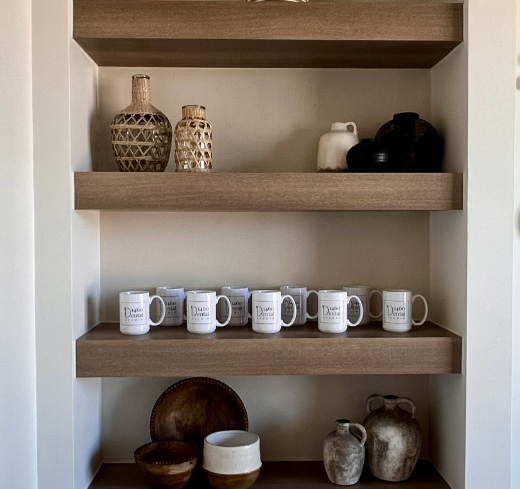 Mugs and other items on brown shelves